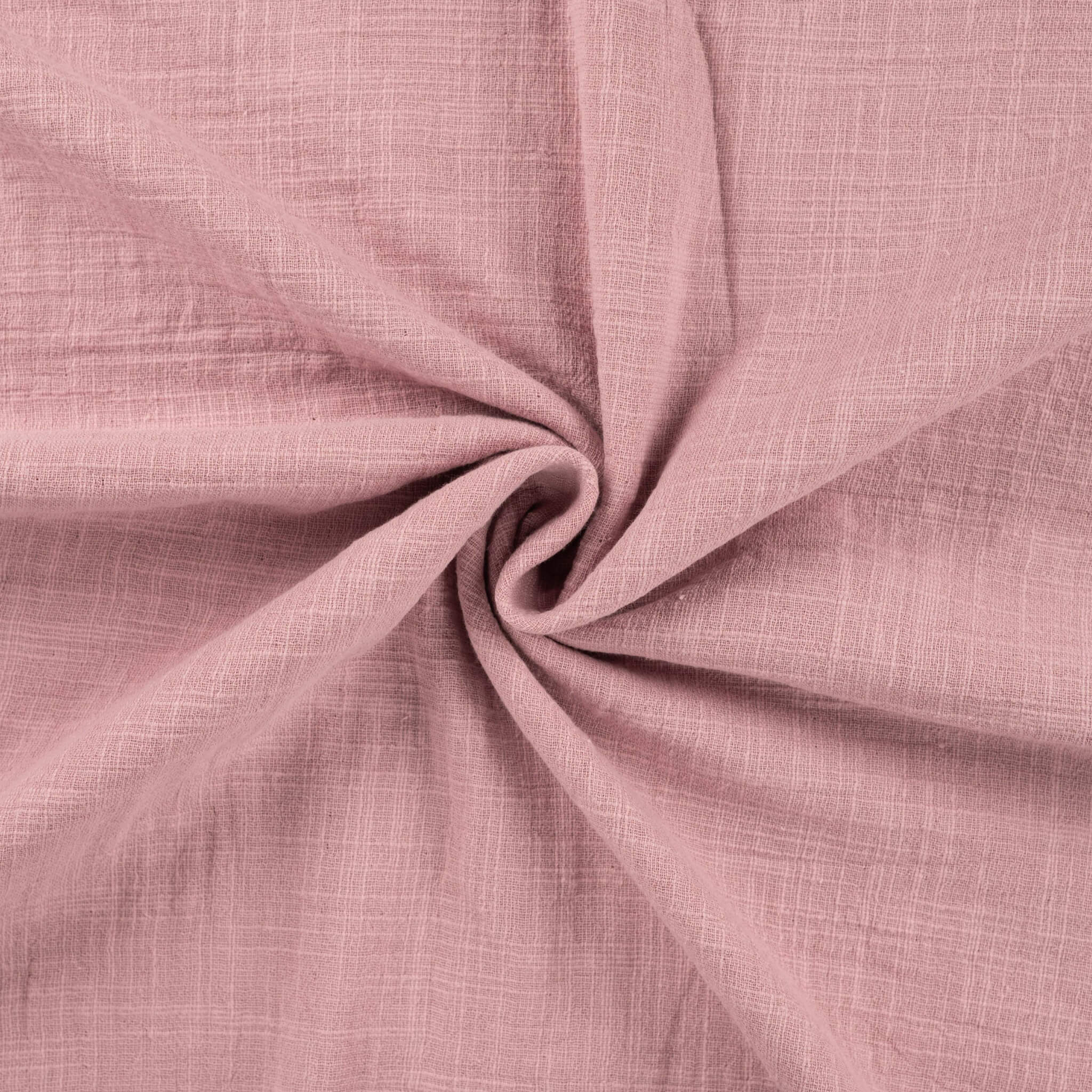 Tissu en double gaze de coton rose vieux à l'aspect gaufré naturel pour couture bébé.