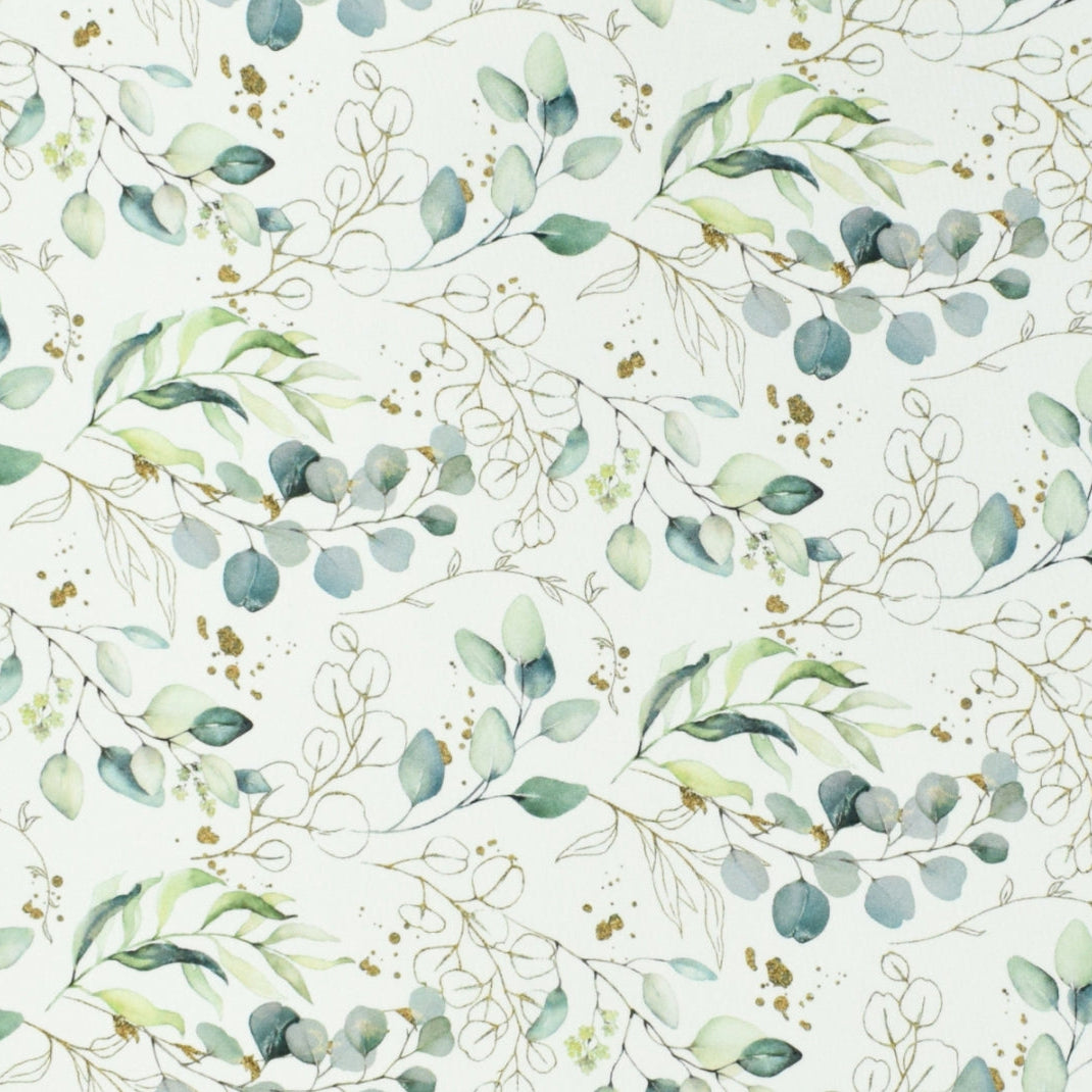 Tissu coton imprimé branches d'eucalyptus aquarelle, feuillage vert sauge et bleu-vert avec touches dorées sur fond blanc